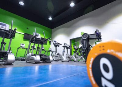 treadmills and a weight, as seen from the ground in the fitness suite at Hazel Grove Sports Centre